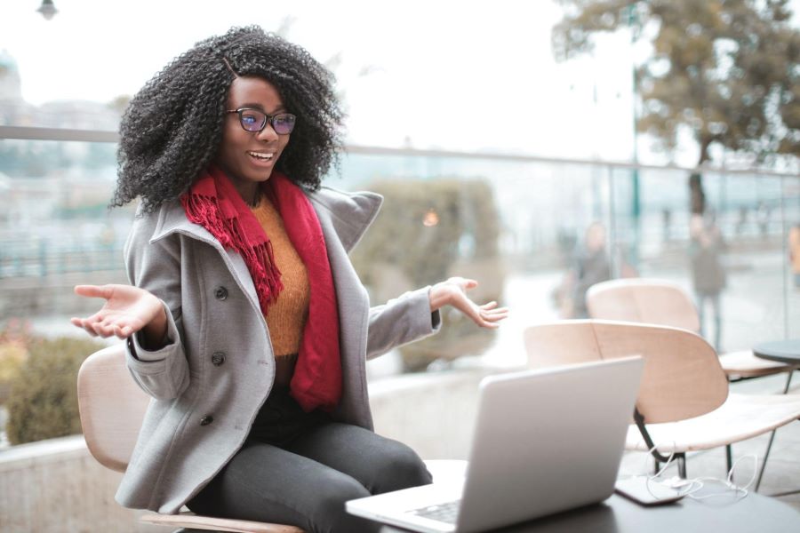 podcast host recording on her laptop