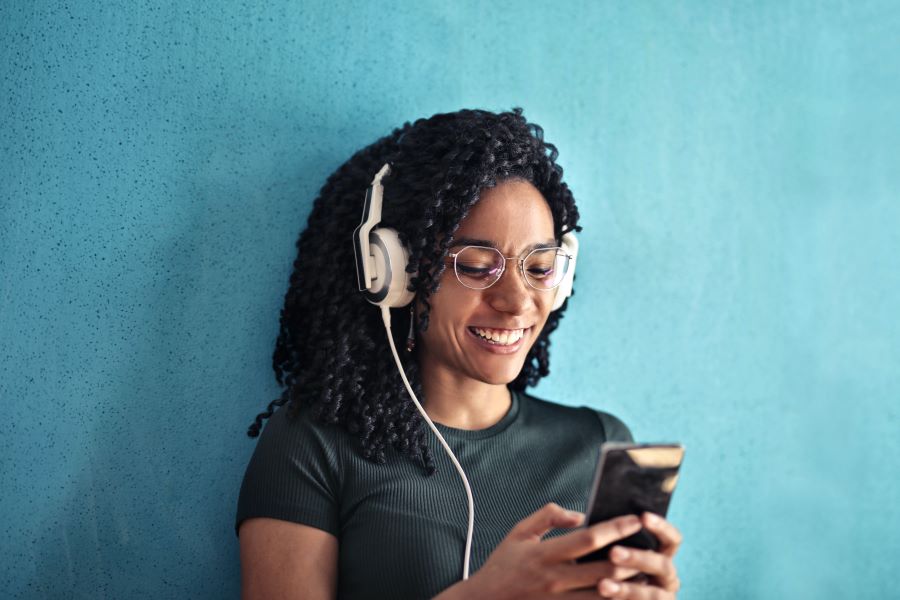 Woman in Black Crew Neck T shirt Wearing White Headphones