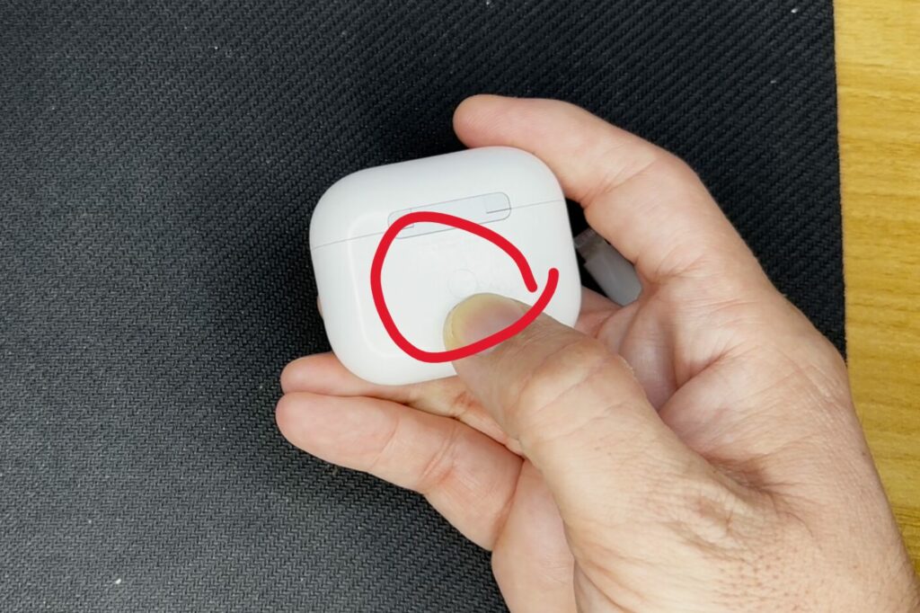 Airpods factory reset button at back of case