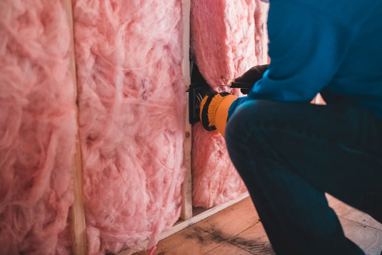 Adding insulation is another cheap soundproofing solution for your home.